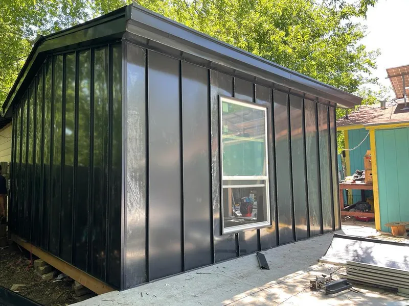 Black standing seam metal wall panels for Metal Roof Installation in Waunakee