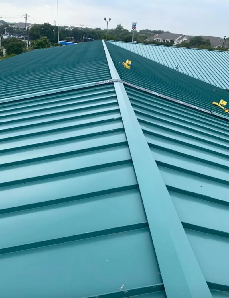 Green commercial metal roof ridge and valley for Metal Roof Repair in Waunakee